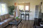 Living room/open kitchen layout make it easty to entertain while getting a meal ready